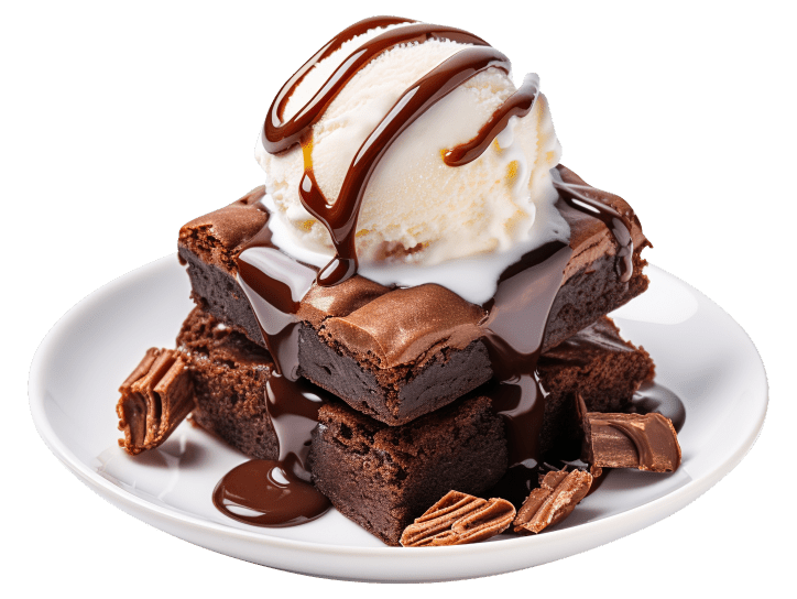 A plate with brownies, ice cream and caramel sauce.