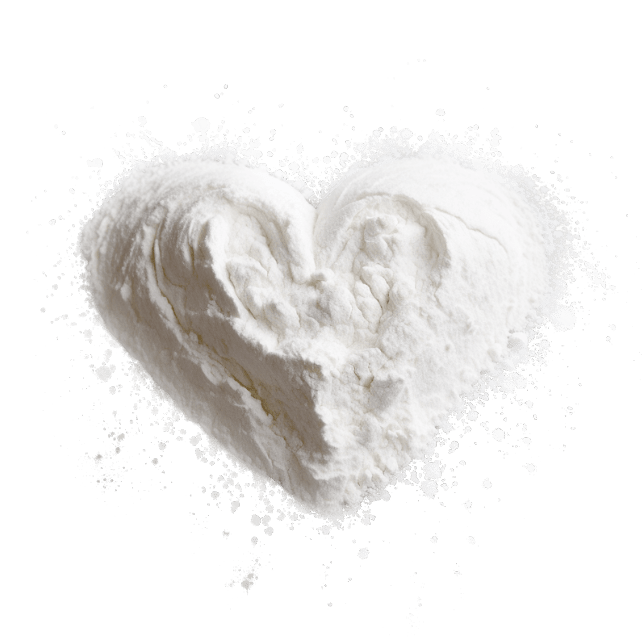 A white powder in the shape of a heart on a black background.