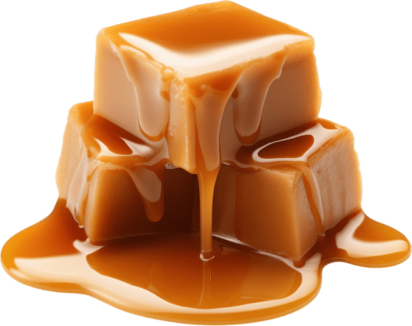 A pile of caramel cubes on a black background.