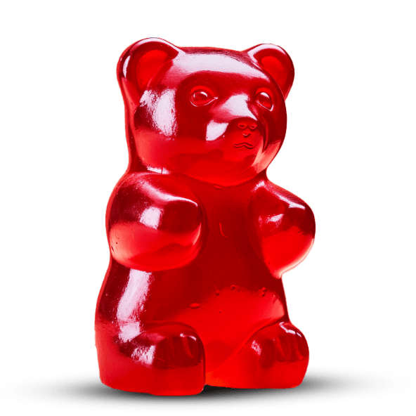 A red gummy bear on a black background.