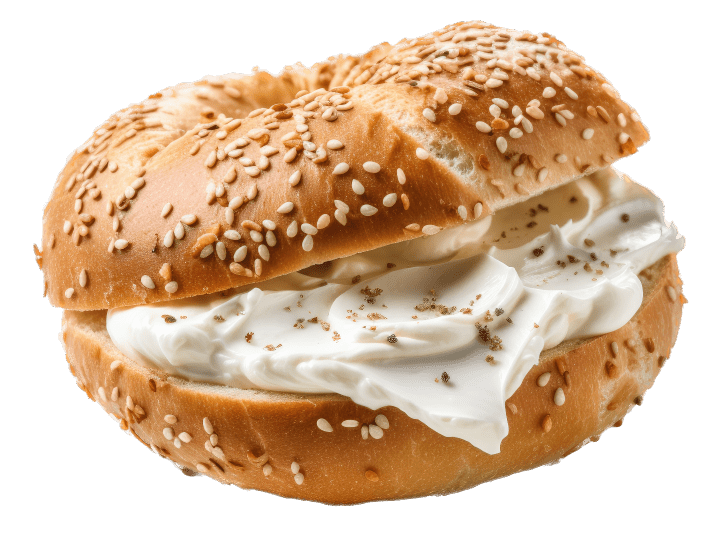 A bagel with cream cheese and sesame seeds.