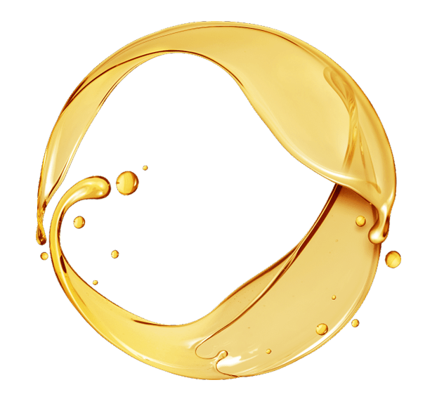 A golden circle with a drop of oil on it.