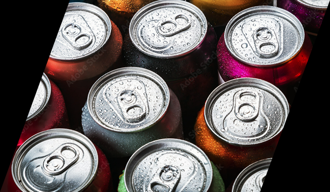 A group of beverage cans are arranged on a black background.