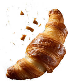 A croissant falling off of a black background.