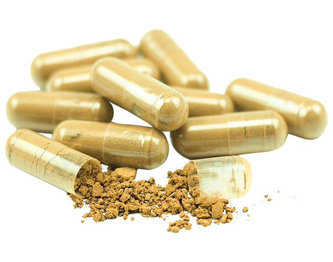 A pile of gold capsules on a black background.